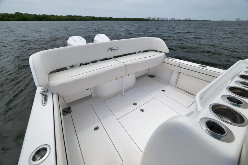 Slide: The Image of 2023 Valhalla Boatworks V-33, spacious deck with seating, on calm waters. - 39