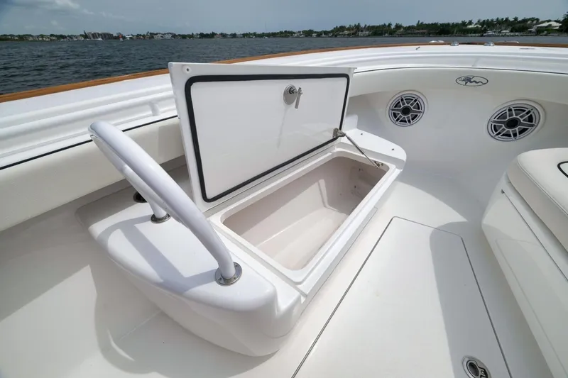 Slide: The Image of 2023 Valhalla Boatworks V-33 open storage compartment on deck, near water. - 22