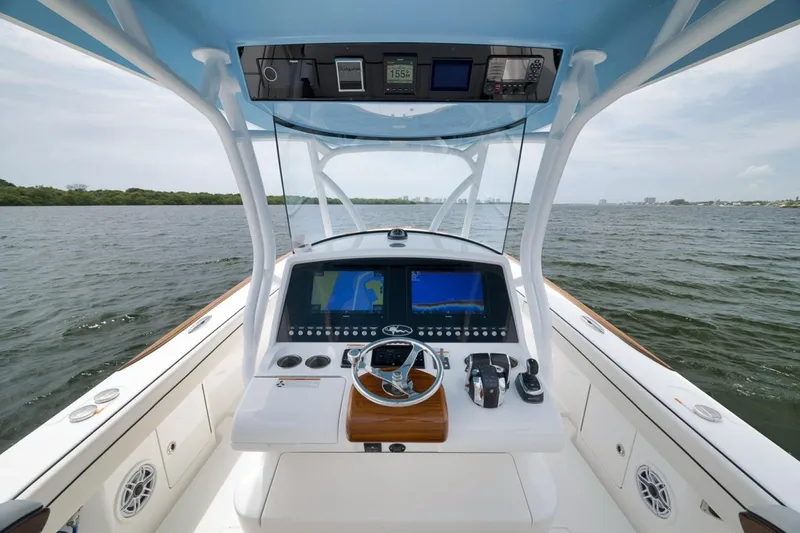 Slide: The Image of 2023 Valhalla Boatworks V-33 helm with advanced navigation system on open water. - 35