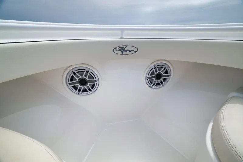 Slide: The Image of 2023 Valhalla Boatworks V-33 interior with dual speakers and sleek design. - 19