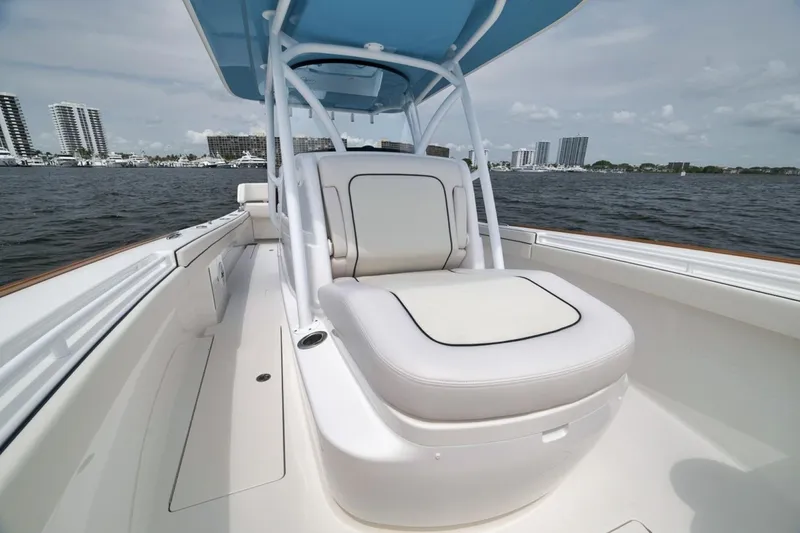 Slide: The Image of 2023 Valhalla Boatworks V-33 with sleek seating, cruising on open water. - 25