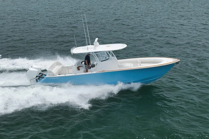 Slide: The Image of 2023 Valhalla Boatworks V-33 cruising on open water, showcasing sleek design and performance. - 11