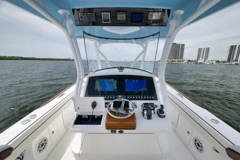 Slide: The Image of 2023 Valhalla Boatworks V-33 helm with advanced navigation system on open water. - 36