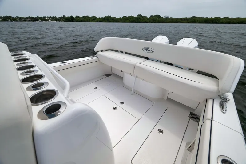 Slide: The Image of 2023 Valhalla Boatworks V-33 interior with seating and cup holders on the water. - 37