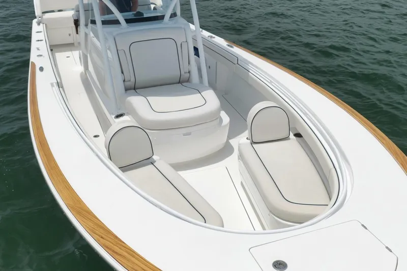 Slide: The Image of 2023 Valhalla Boatworks V-33 with sleek seating, cruising on calm waters. - 3