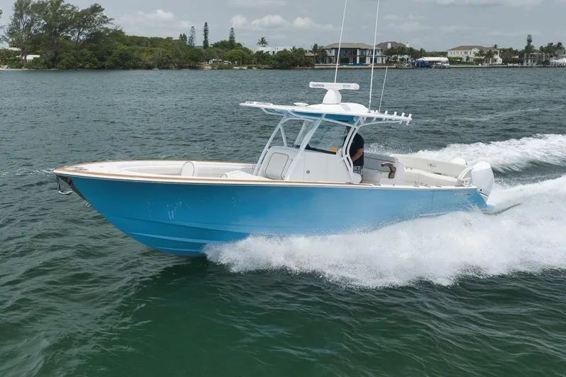 Slide: The Image of 2023 Valhalla Boatworks V-33 cruising on open water, showcasing sleek design and performance. - 15