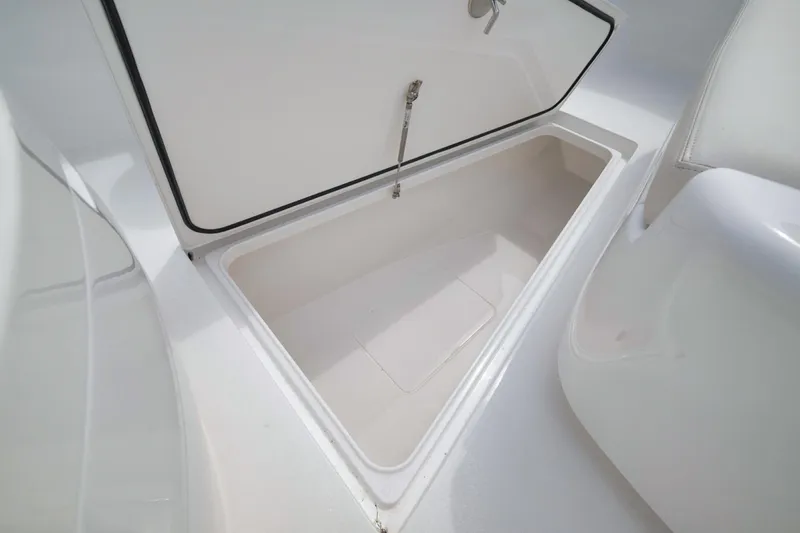 Slide: The Image of 2023 Valhalla Boatworks V-33 storage compartment, open and empty, showcasing interior space. - 24