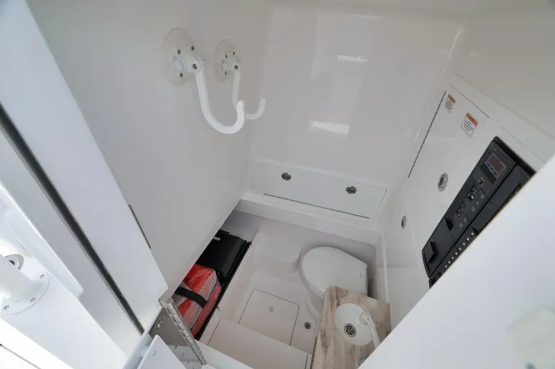 Slide: The Image of 2023 Valhalla Boatworks V-33 interior cabin with toilet and storage compartments. - 31
