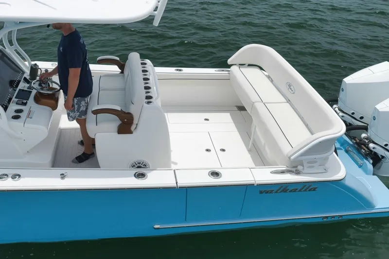 Slide: The Image of 2023 Valhalla Boatworks V-33 with sleek design and spacious seating on open water. - 8