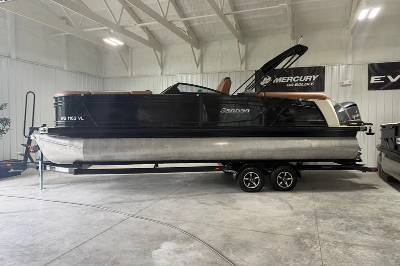 The Image of 2018 Godfrey Sanpan 2500 ULC pontoon boat on trailer in indoor showroom. - 1