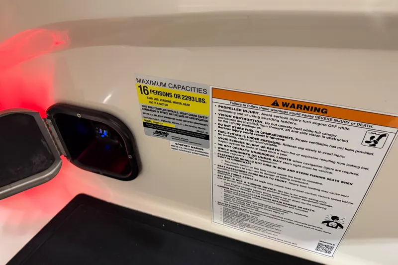 Slide: The Image of Safety and capacity labels on a 2018 Godfrey Sanpan 2500 ULC boat. - 13
