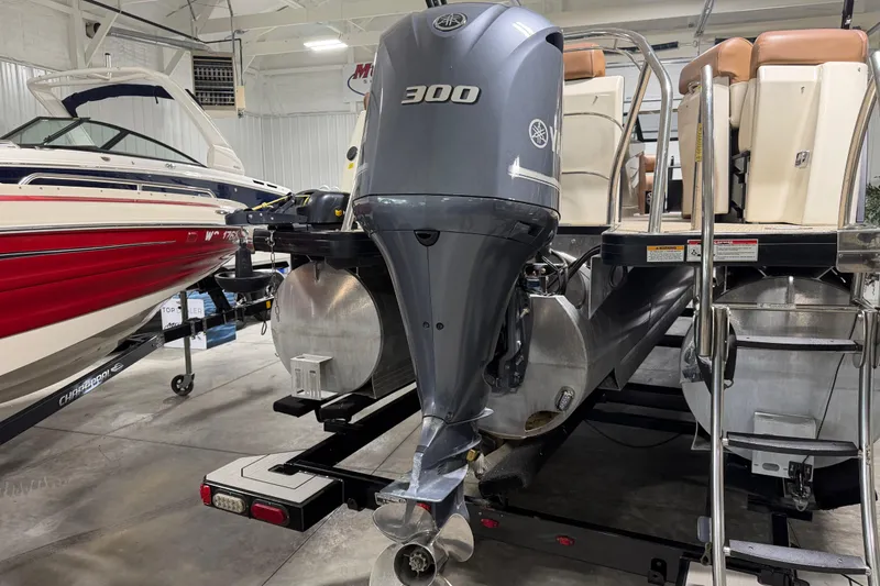 Slide: The Image of 2018 Godfrey Sanpan 2500 ULC pontoon boat with Yamaha 300 outboard motor in showroom. - 19