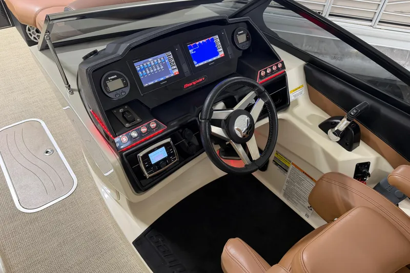 Slide: The Image of 2018 Godfrey Sanpan 2500 ULC boat dashboard with modern controls and steering wheel. - 12