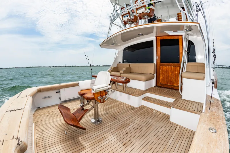 Slide: The Image of Custom Carolina Scarborough 56 Convertible yacht, 1993 model, with spacious deck and seating area. - 10