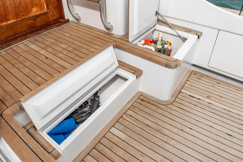 Slide: The Image of Storage compartments on a 1993 Custom Carolina Scarborough 56 Convertible yacht deck. - 12