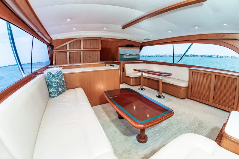 Slide: The Image of Luxurious interior of 1993 Custom Carolina Scarborough 56 Convertible yacht with elegant wood finishes. - 16
