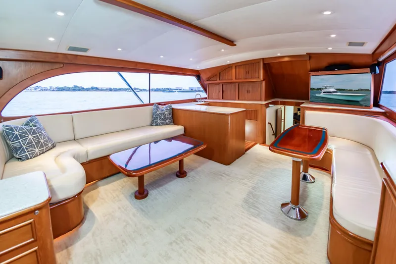 Slide: The Image of Luxurious interior of 1993 Custom Carolina Scarborough 56 Convertible yacht with elegant wood finishes. - 2