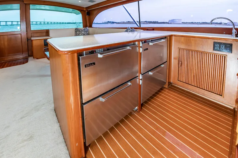 Slide: The Image of Luxurious interior of 1993 Custom Carolina Scarborough 56 Convertible yacht with modern kitchen amenities. - 20