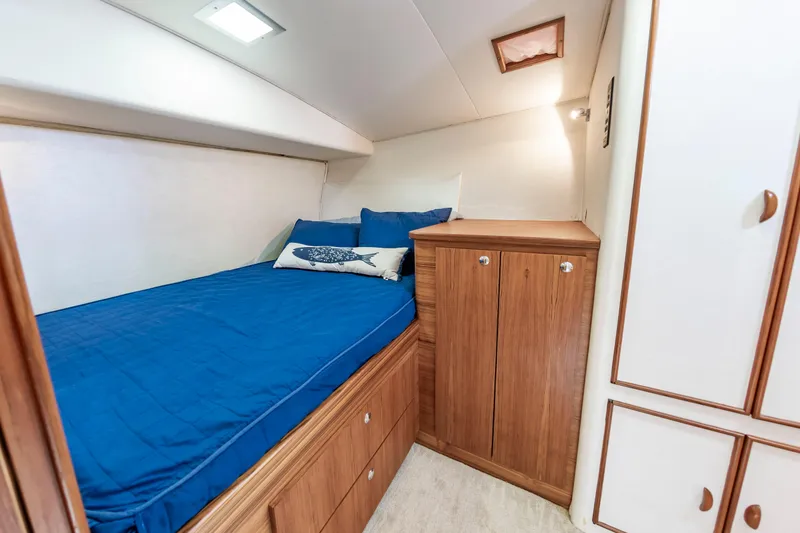 Slide: The Image of Cozy cabin interior of 1993 Custom Carolina Scarborough 56 Convertible with blue bedding. - 24