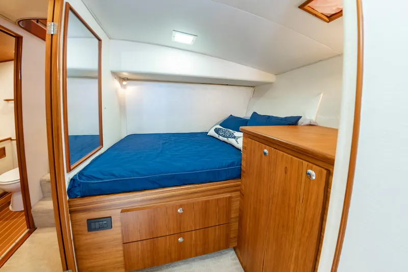 Slide: The Image of Luxurious cabin interior of 1993 Custom Carolina Scarborough 56 Convertible yacht. - 25