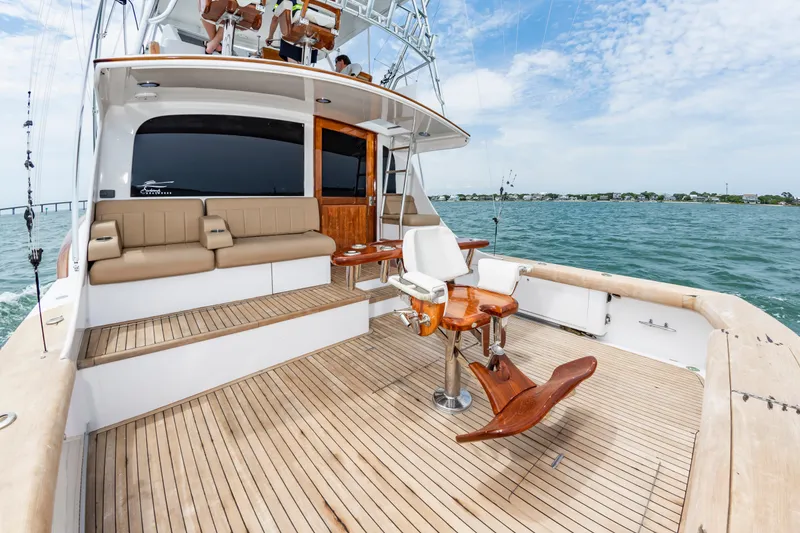 Slide: The Image of Luxurious 1993 Custom Carolina Scarborough 56 Convertible yacht with spacious deck and seating. - 3