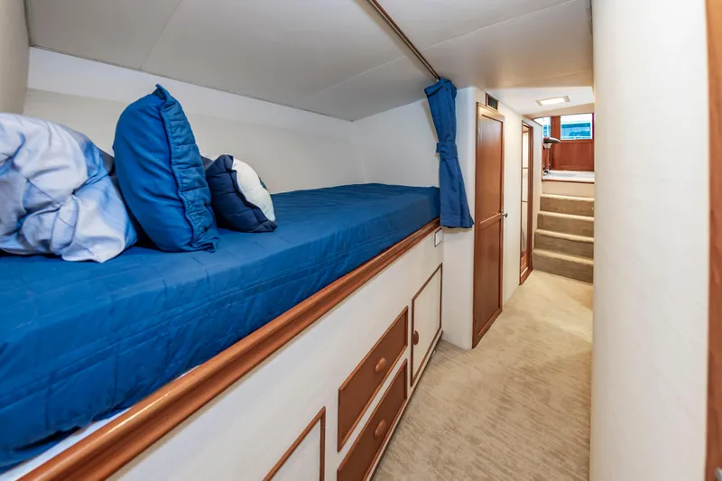 Slide: The Image of Interior of 1993 Custom Carolina Scarborough 56 Convertible with blue bedding and wooden accents. - 34