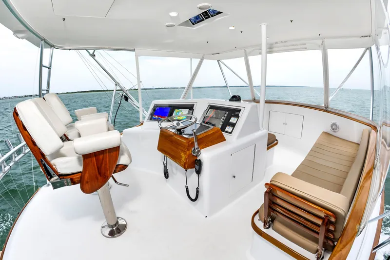 Slide: The Image of Helm of 1993 Custom Carolina Scarborough 56 Convertible yacht with ocean view. - 4