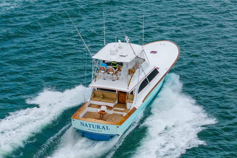 Slide: The Image of Custom Carolina Scarborough 56 Convertible yacht cruising on open water, 1993 model. - 44