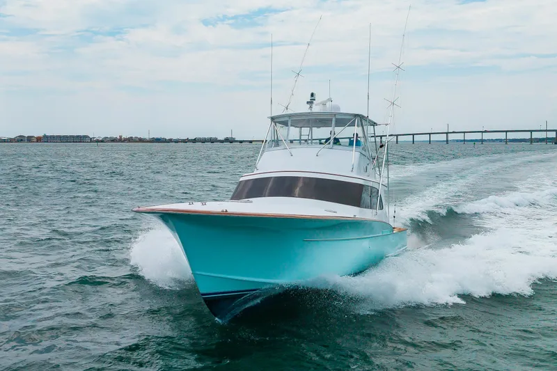 Slide: The Image of Custom Carolina Scarborough 56 Convertible yacht cruising on open water, 1993 model. - 46