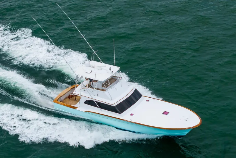 Slide: The Image of Custom Carolina Scarborough 56 Convertible yacht cruising on open water, 1993 model. - 48