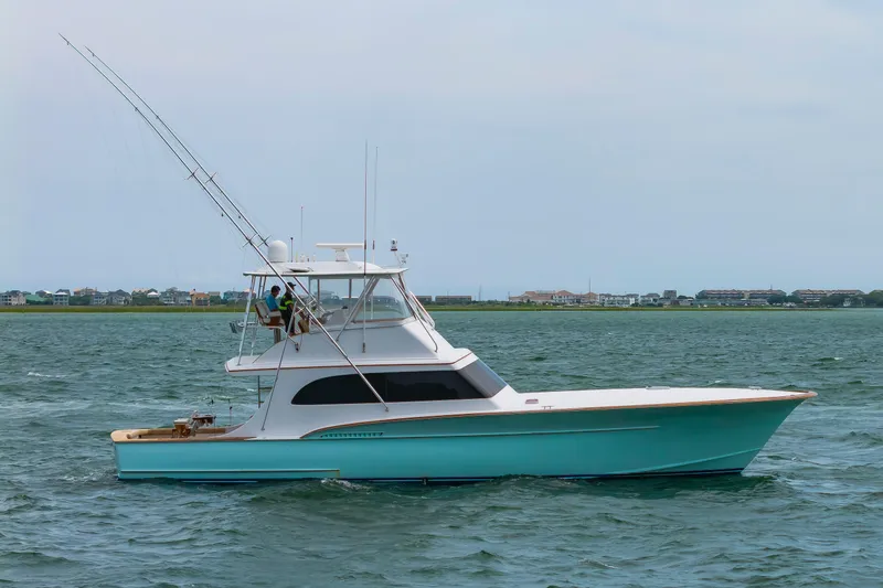 Slide: The Image of Custom Carolina Scarborough 56 Convertible yacht, 1993 model, cruising on open water. - 52