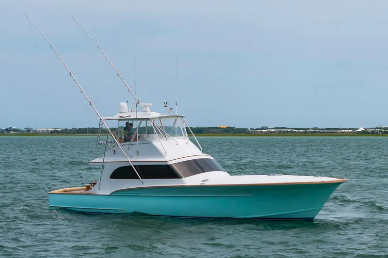 Slide: The Image of Custom Carolina Scarborough 56 Convertible yacht, 1993 model, cruising on open water. - 53