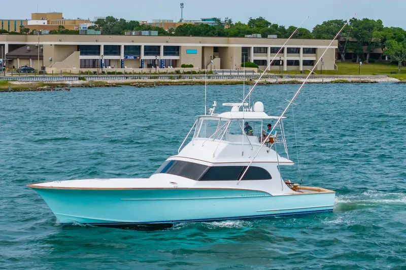Slide: The Image of Custom Carolina Scarborough 56 Convertible yacht cruising on water, 1993 model. - 58