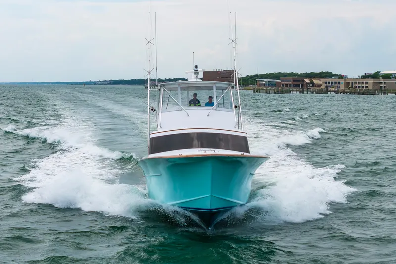 Slide: The Image of Custom Carolina Scarborough 56 Convertible yacht cruising on open water, 1993 model. - 59