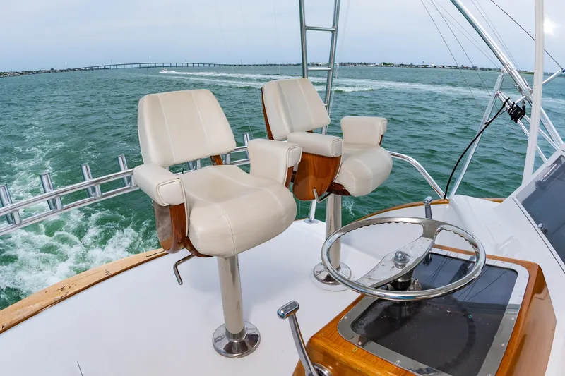 Slide: The Image of Helm of 1993 Custom Carolina Scarborough 56 Convertible yacht with dual captain chairs. - 6