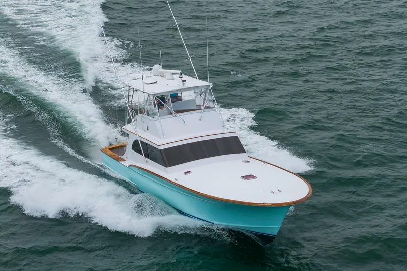 Slide: The Image of Custom Carolina Scarborough 56 Convertible yacht cruising on open water, 1993 model. - 61