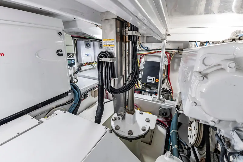 Slide: The Image of Engine room of 1993 Custom Carolina Scarborough 56 Convertible, showcasing mechanical components and wiring. - 63
