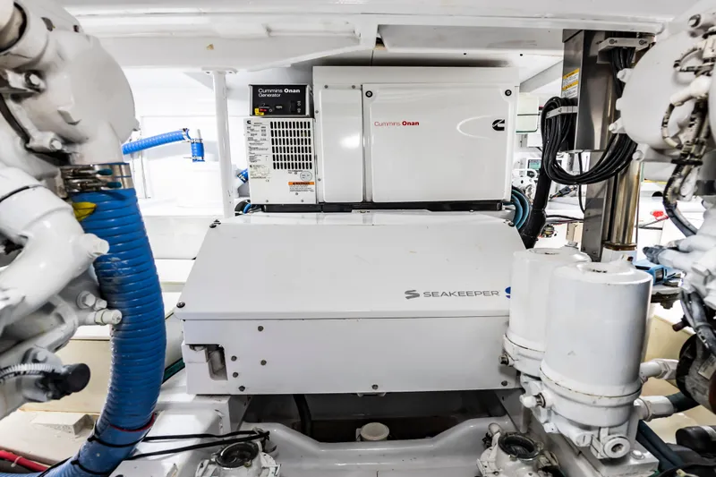 Slide: The Image of Engine room of 1993 Custom Carolina Scarborough 56 Convertible with Cummins Onan generator and Seakeeper system. - 67