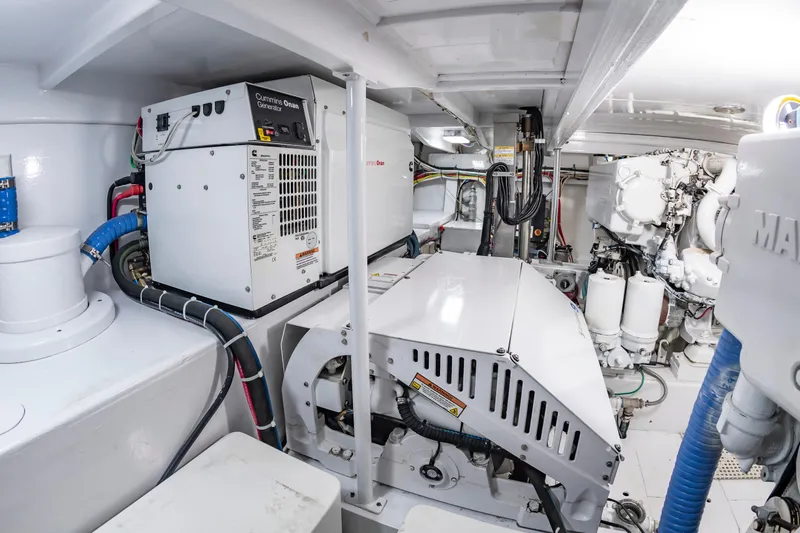 Slide: The Image of Engine room of 1993 Custom Carolina Scarborough 56 Convertible with Cummins Onan generator. - 68