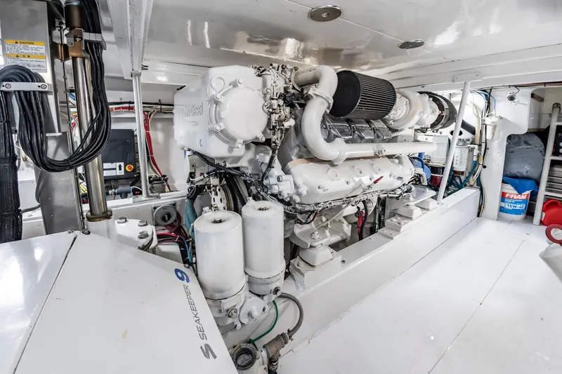 Slide: The Image of Engine room of 1993 Custom Carolina Scarborough 56 Convertible yacht, featuring Seakeeper 9 stabilizer. - 69