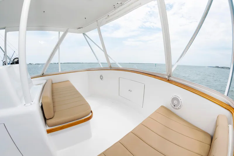 Slide: The Image of Interior view of 1993 Custom Carolina Scarborough 56 Convertible yacht with beige seating. - 8