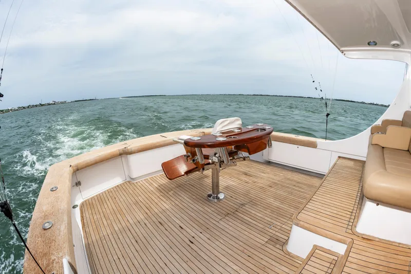 Slide: The Image of Custom Carolina Scarborough 56 Convertible yacht deck, 1993 model, cruising on open water. - 9