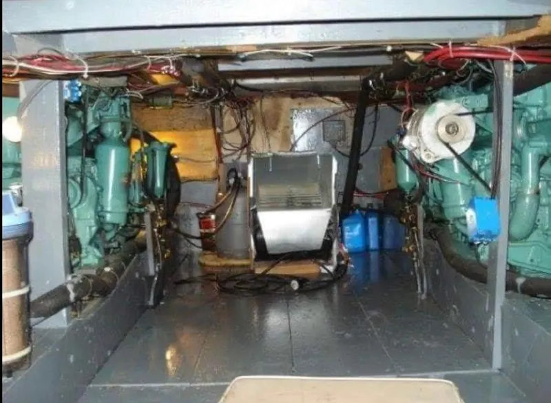 Slide: The Image of 1951 Chris-Craft Catalina engine room with visible machinery and wiring. - 35