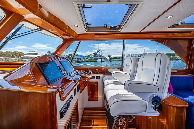 Slide: The Image of Luxurious interior of 2015 Hinckley Talaria 48 yacht with plush seating and advanced navigation system. - 15