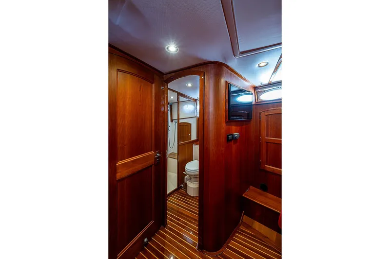 Slide: The Image of Luxurious wooden interior of 2015 Hinckley Talaria 48 yacht bathroom. - 26
