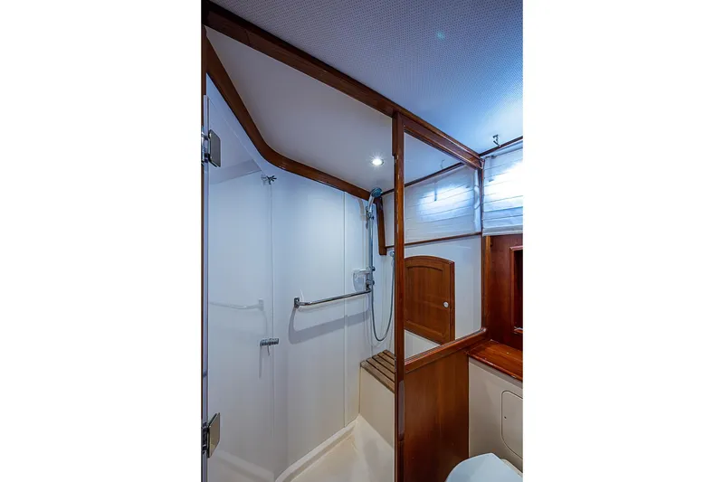 Slide: The Image of Luxurious bathroom interior of 2015 Hinckley Talaria 48 yacht with wooden accents. - 28