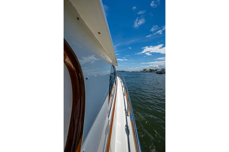 Slide: The Image of 2015 Hinckley Talaria 48 yacht cruising on a sunny day with clear blue skies. - 29