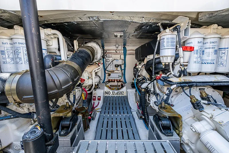 Slide: The Image of Engine room of a 2015 Hinckley Talaria 48 yacht, showcasing mechanical components. - 33