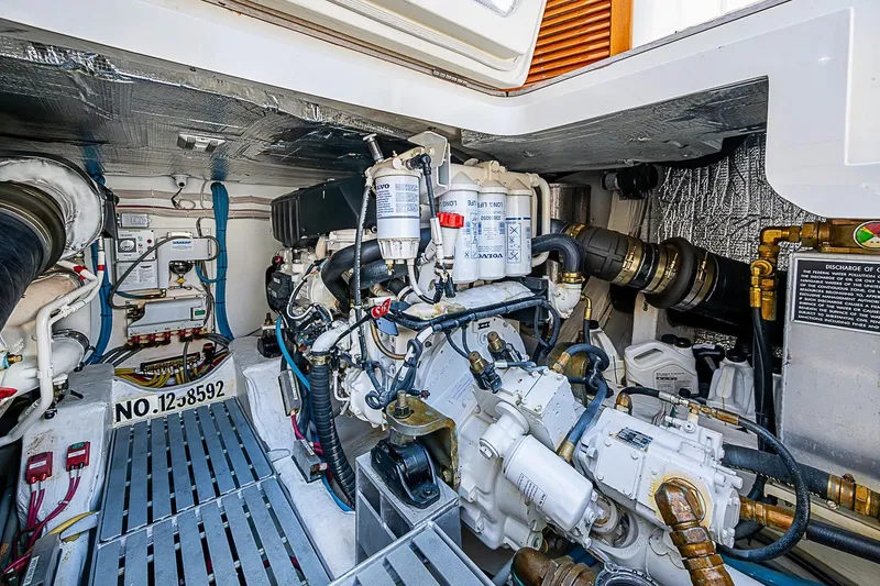 Slide: The Image of Engine room of a 2015 Hinckley Talaria 48 yacht, showcasing mechanical components and systems. - 34