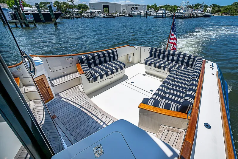 Slide: The Image of Hinckley Talaria 48 yacht deck with striped seating, cruising on a sunny day, 2015 model. - 8